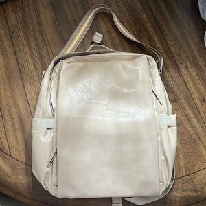 NWOT Backpack with multiple pockets and should strap, will hold 15” computer.